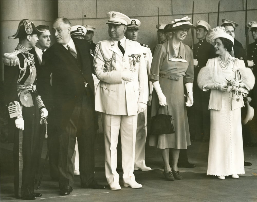President Roosevelt in conversation with King George VI while Eleanor Roosevelt and Queen Elizabeth exchange pleasantries at Union Station.