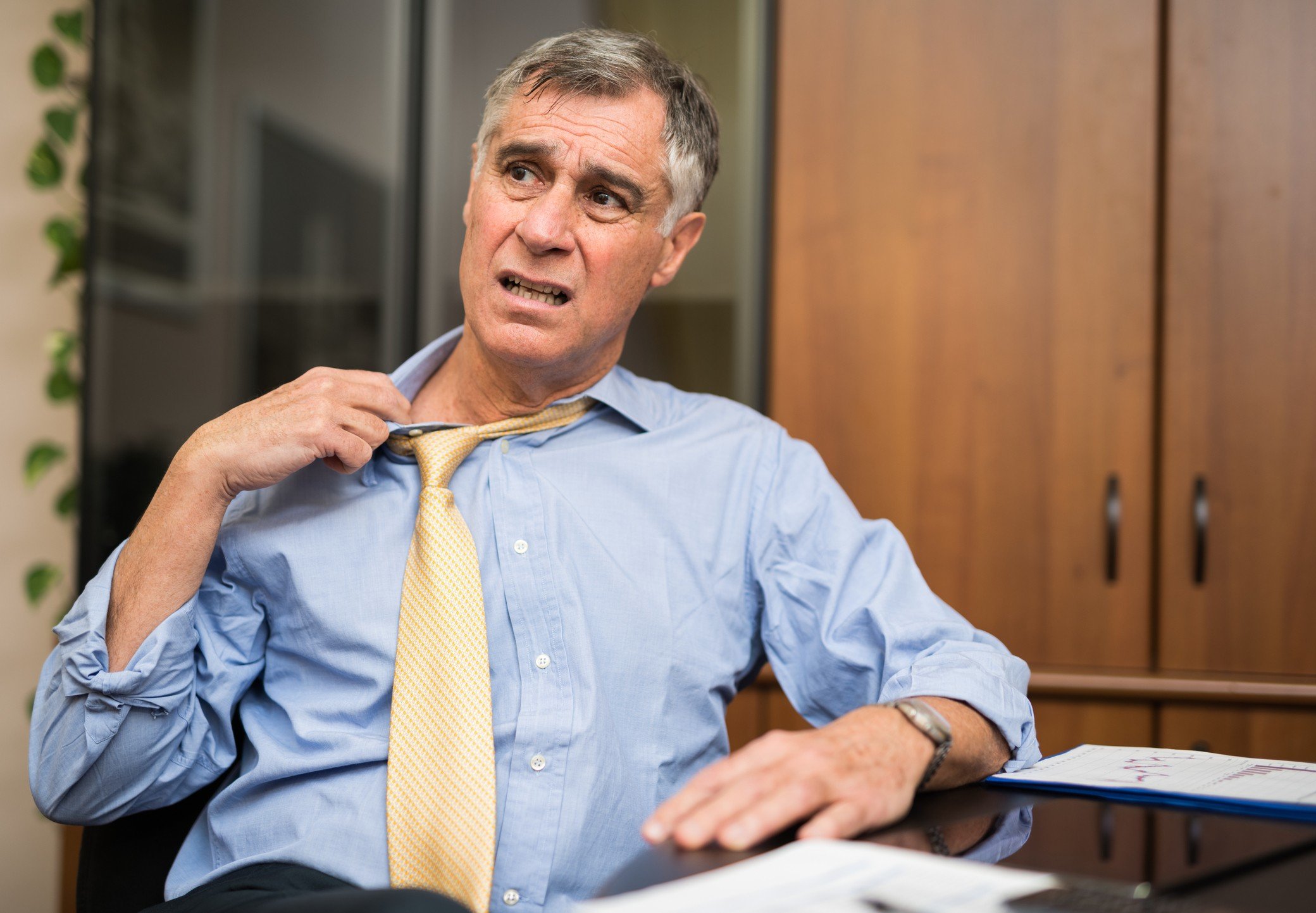 Businessman sweating in his office