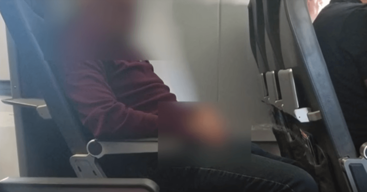 Man urinating on seat on plane