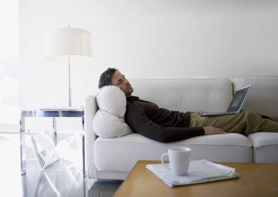 Man taking a nap in his office