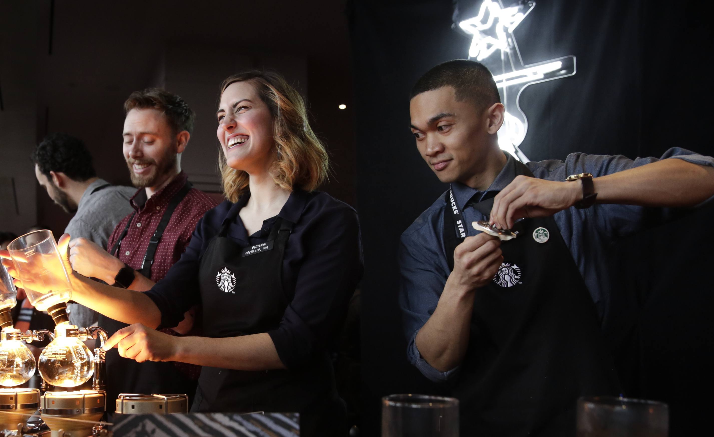 Baristas brew siphon coffee at Starbucks' Annual Meeting