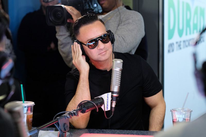 Mike Sorrentino wears black sunglasses during a radio interview. 