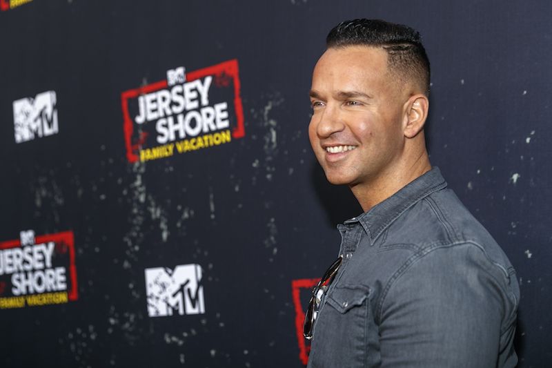 Mike Sorrentino smiling on a red carpet. 