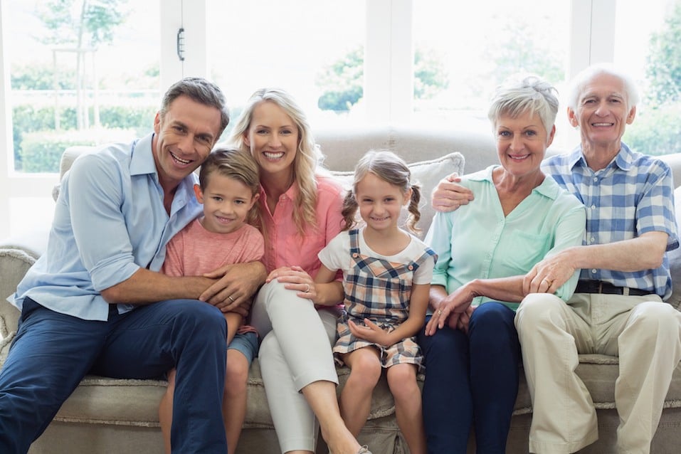 family family sitting on sofa