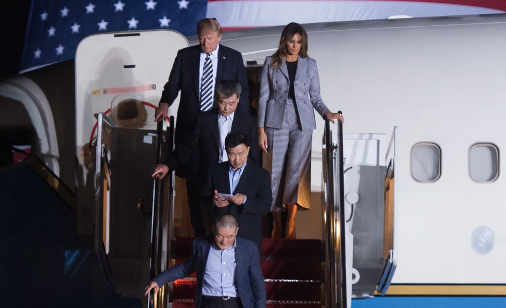 Donald and melania trump with the North Korean prisoners