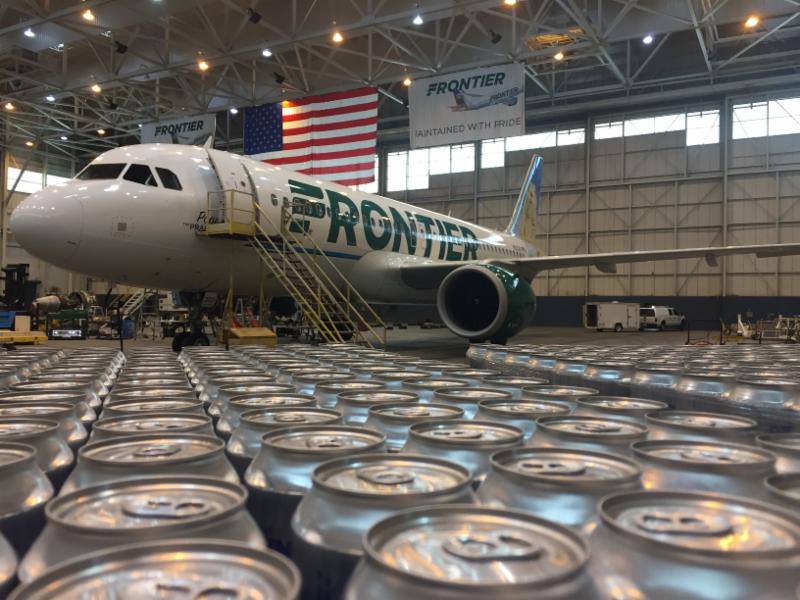 Frontier airlines plane with rows of beer cans