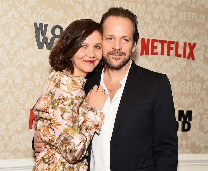 Maggie Gyllenhaal and Peter Sarsgaard posing for photographers. 
