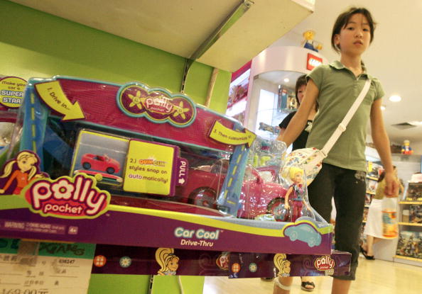 A young girl walks past "Polly Pocket" toys made by U.S. toy giant Matte A young girl walks past "Polly Pocket" toys made by U.S. toy giant Matte