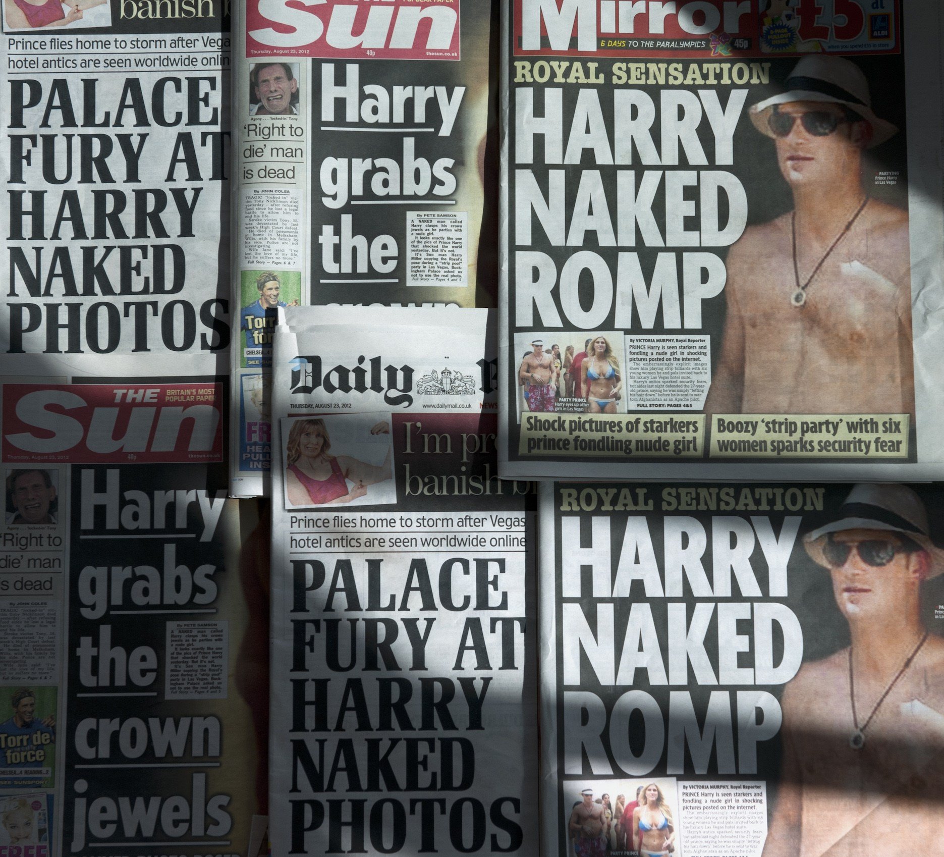 An arrangement of British daily newspapers photographed in London on August 23, 2012 shows the front-page headlines and stories regarding nude pictures of Britain's Prince Harry