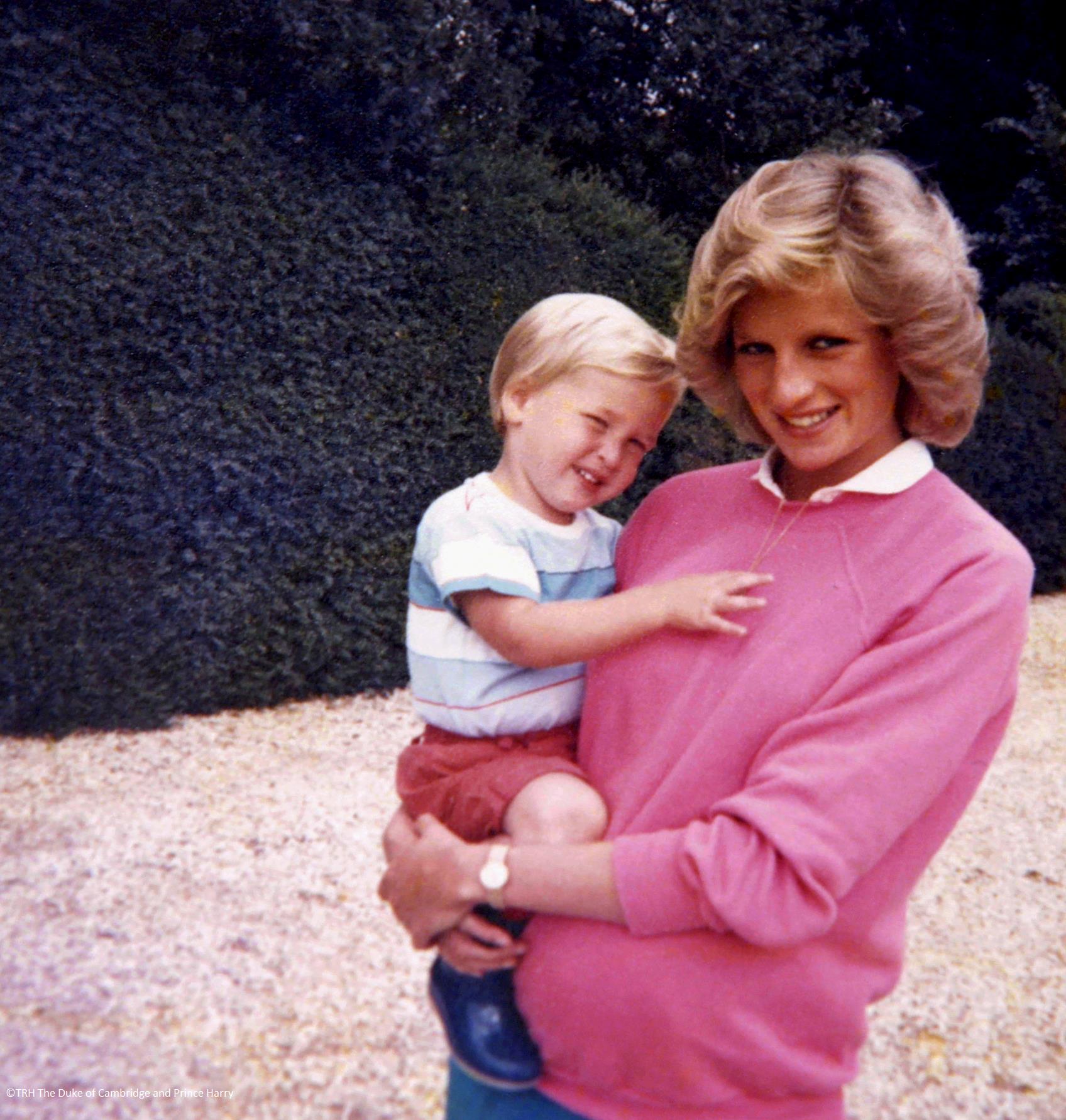 Princess Diana holding Prince William