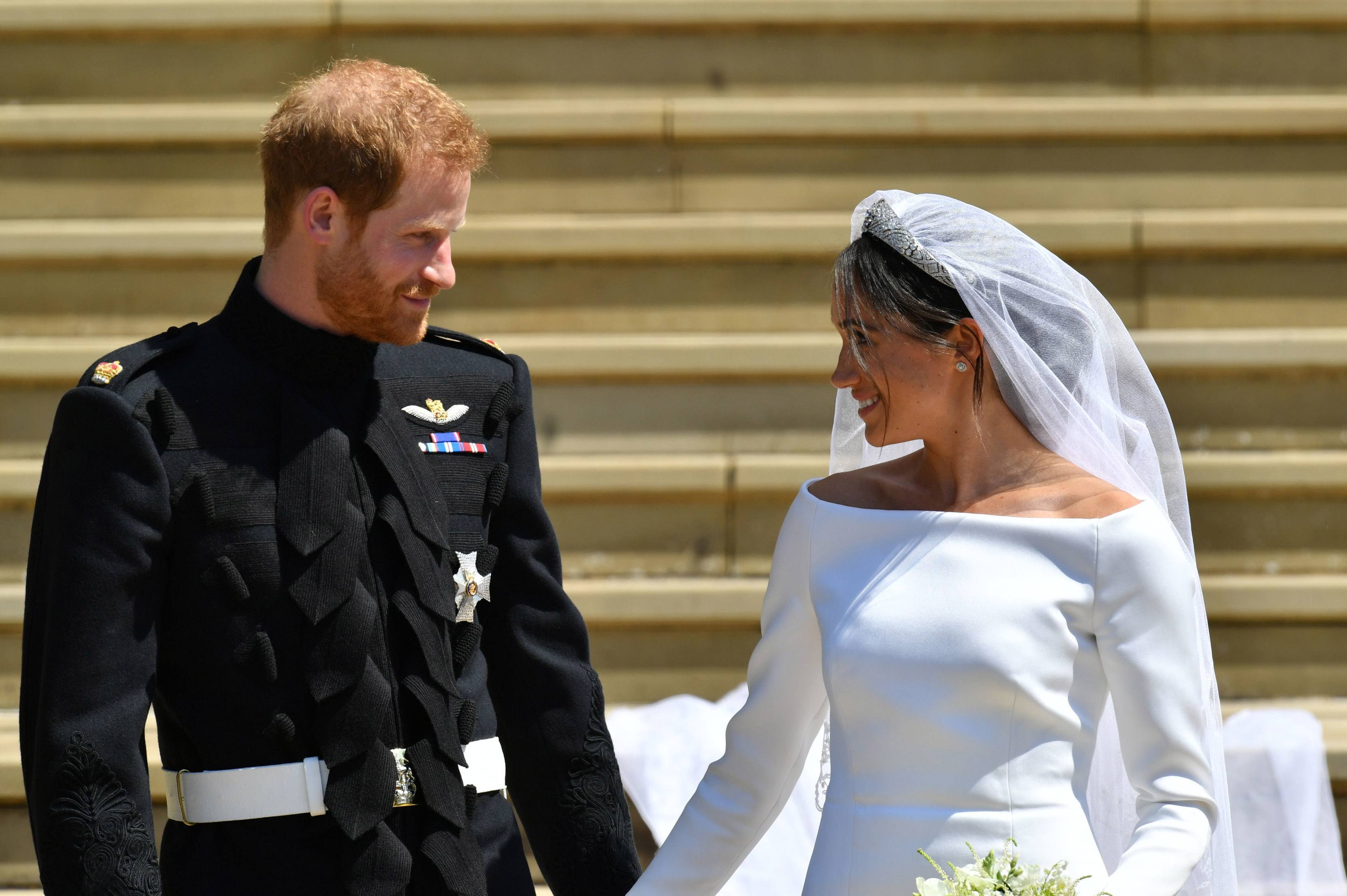 Prince Harry and Meghan Markle on church steps after their wedding
