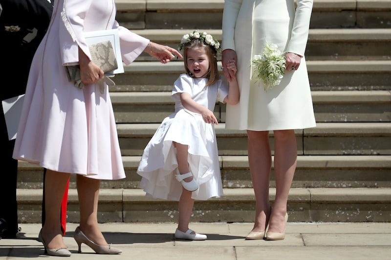 Princess Charlotte of Cambridge stands on the steps with her mother Catherine, Duchess of Cambridge