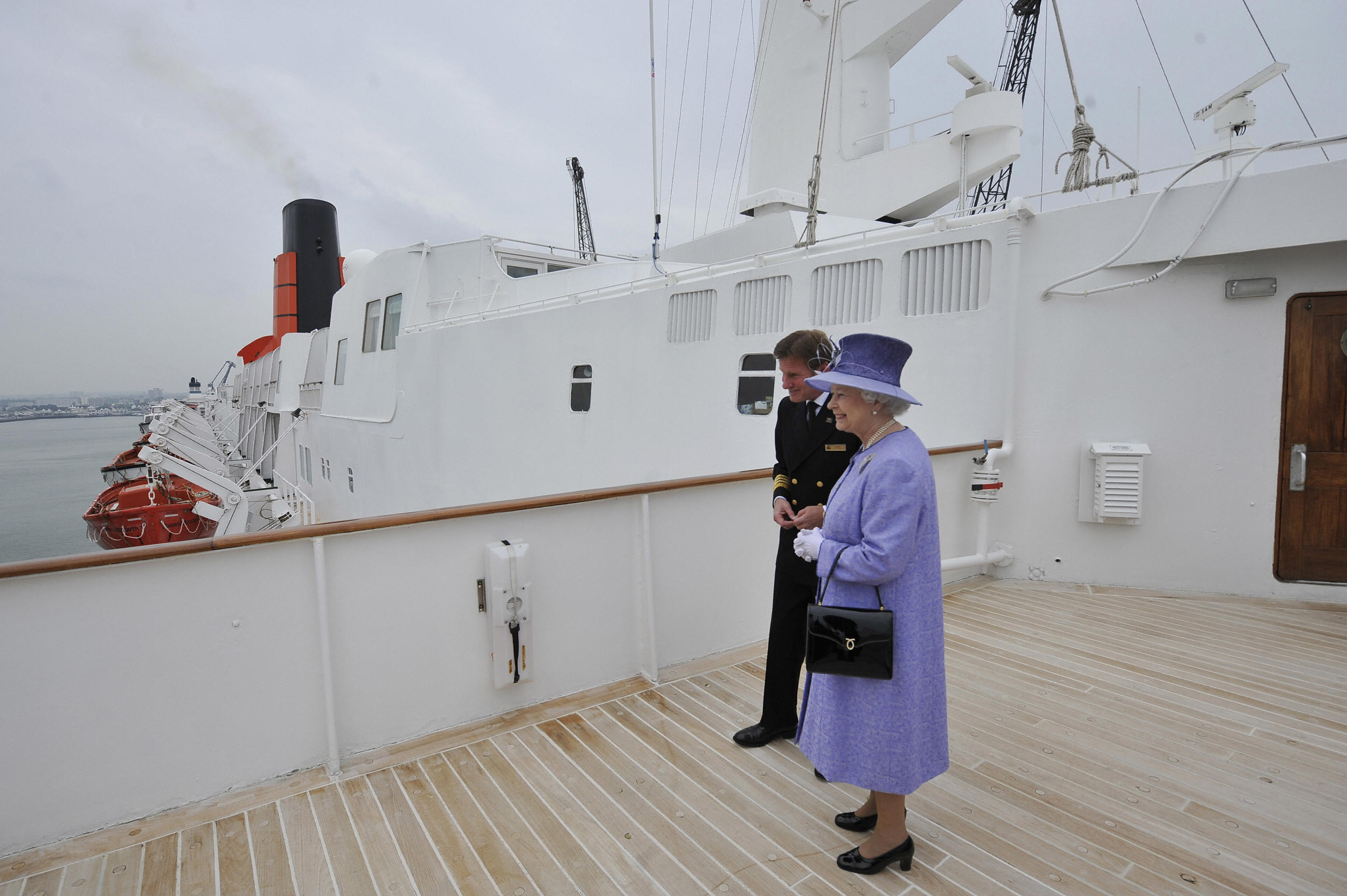 Britain's Queen Elizabeth II (R) is pictured during her visit of the Queen Elizabeth 2