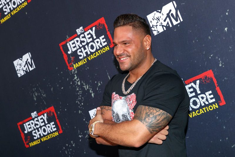Ronnie Ortiz-Magro posing on a red carpet. Ronnie Ortiz-Magro posing on a red carpet.