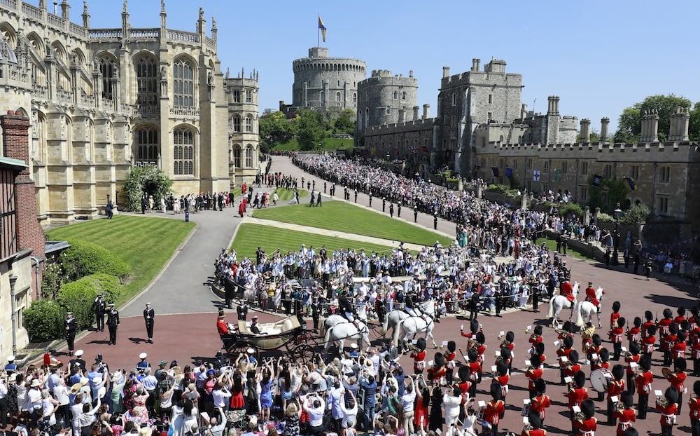 Prince Harry, Duke of Sussex and The Duchess of Sussex leave Windsor Castle in the Ascot Landau carriage during a procession after getting married at St Georges Chapel on May 19, 2018 in Windsor, England. Prince Harry, Duke of Sussex and The Duchess of Sussex leave Windsor Castle in the Ascot Landau carriage during a procession after getting married at St Georges Chapel on May 19, 2018 in Windsor, England.