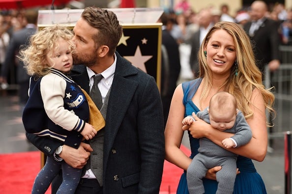 Actors Ryan Reynolds (L) and Blake Lively pose with their daughters as Ryan Reynolds is honored with star on the Hollywood Walk of Fame
