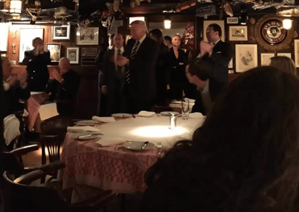 Donald Trump enters the 21 Club restaurant.