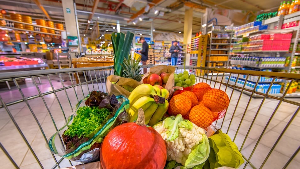 Grocery shop cart in supermarket filled up
