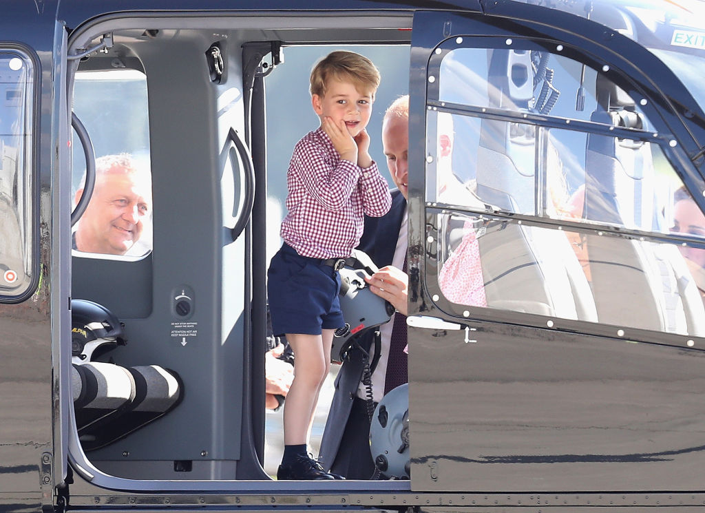 Prince William, Duke of Cambridge, Catherine, Duchess of Cambridge, Prince George of Cambridge and Princess Charlotte of Cambridge view helicopter models H145 and H135