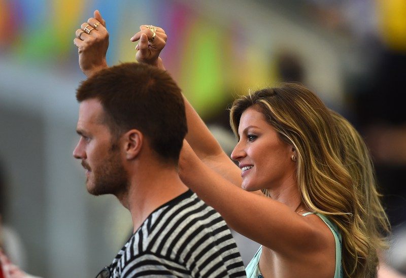 Gisele Bündchen cheers as she stands next time to Tom Brady. Gisele Bündchen cheers as she stands next time to Tom Brady.