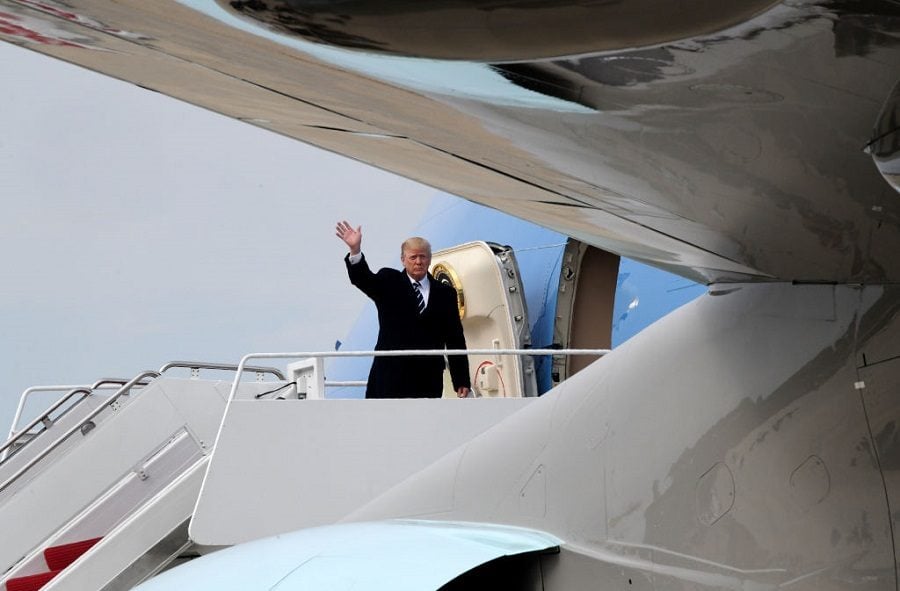 Donald Trump waving on an airplane