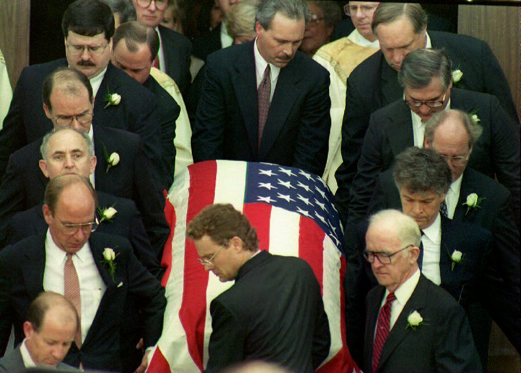 Pallbearers remove the casket of deputy White House counsel Vince Foster Jr.