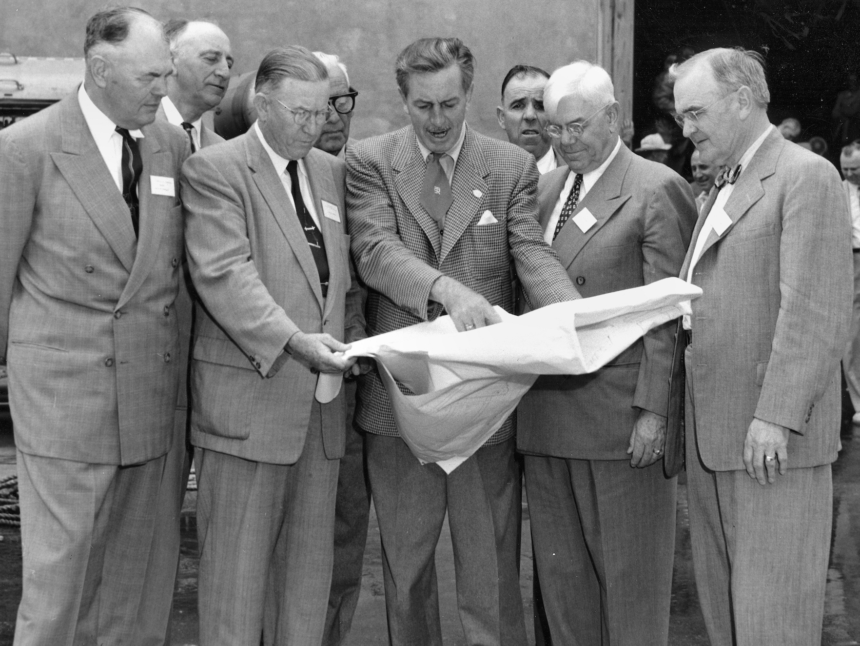 Walt Disney shows Disneyland plans to Orange County officials in December 1954.