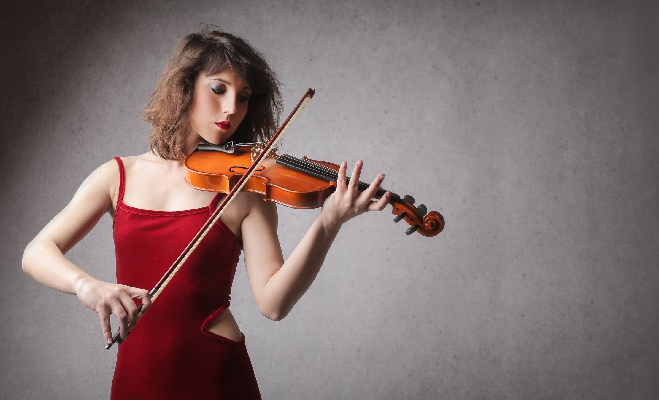 Woman in red playing Vioin Woman in red playing Vioin