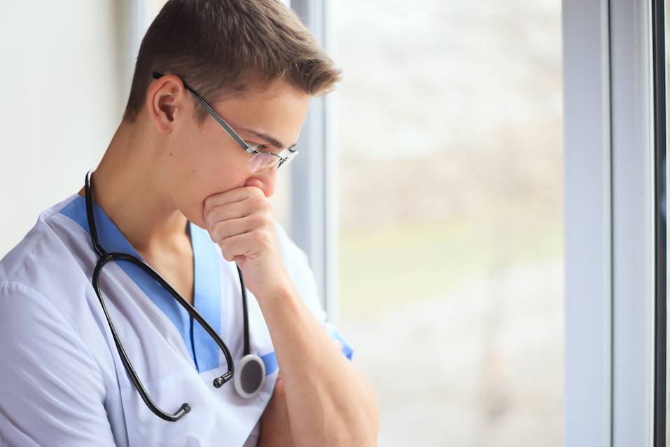 Young doctor thinking