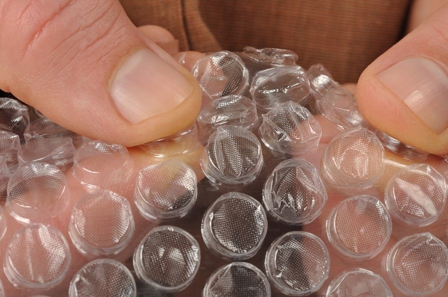 hands with bubble wrap