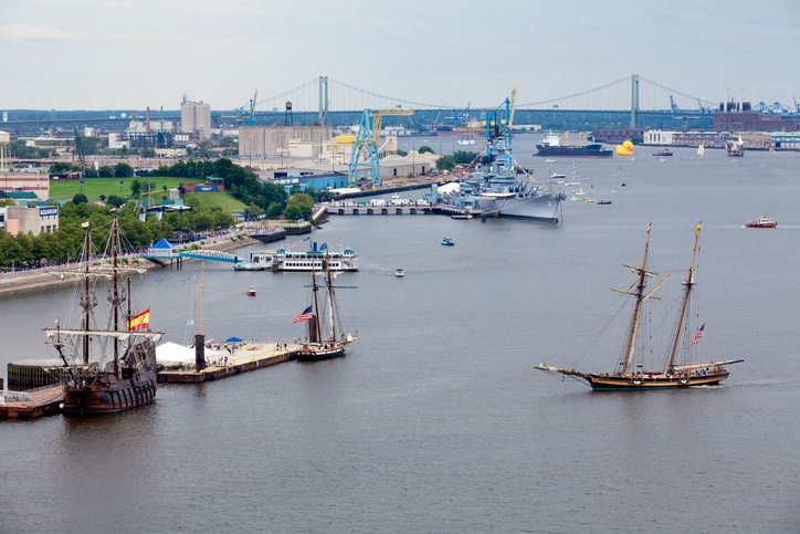 Tall sailing ships coming into port on the waterfront in Camden, New Jersey along the Delaware River