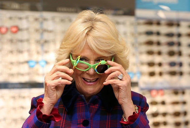 The Duchess of Cornwall tries on glasses at Boots Opticians in Peterborough during a day of visits to promote reading and storytelling as part of her role with the National Literacy Trust.