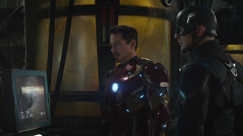 Iron Man and Captain America look at security footage