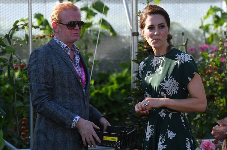 BBC Radio 2 presenter Chris Evans watches as Britain's Catherine, Duchess of Cambridge, samples a tomato at the 'BBC Radio 2: Chris Evans Taste Garden' during her visit to the Chelsea Flower Show in London on May 22, 2017.
