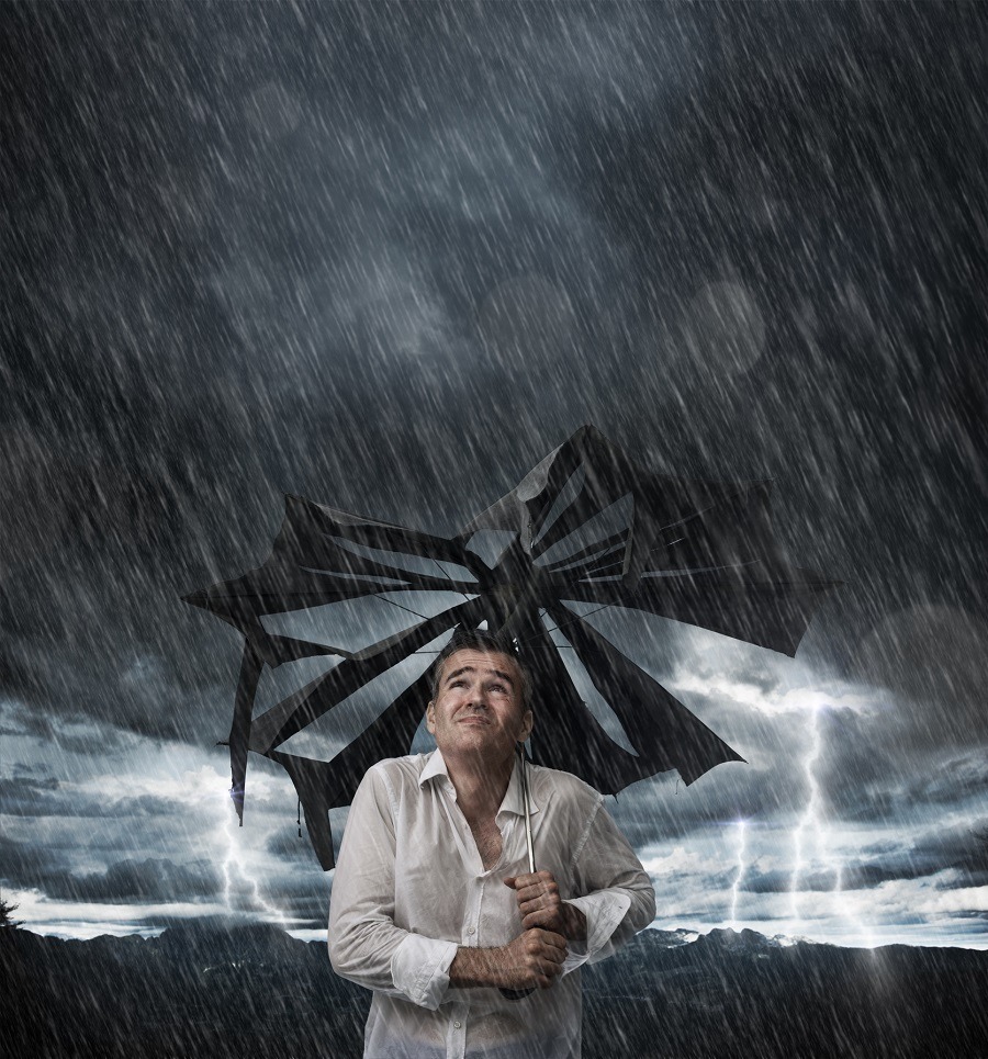 Man in rain in umberalla Man in rain in umberalla