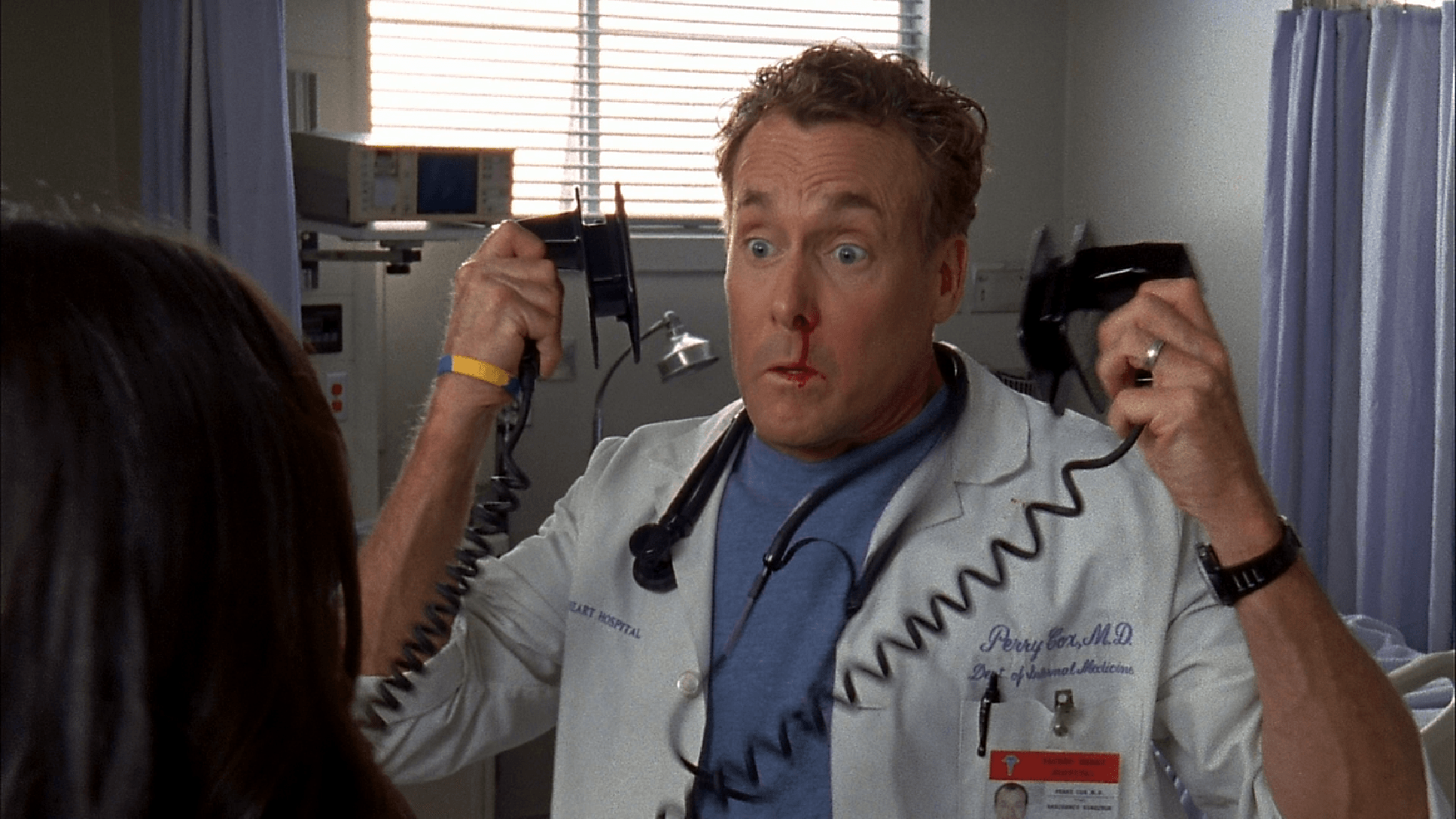 Dr. Cox holding defibrillators on Scrubs Dr. Cox holding defibrillators on Scrubs