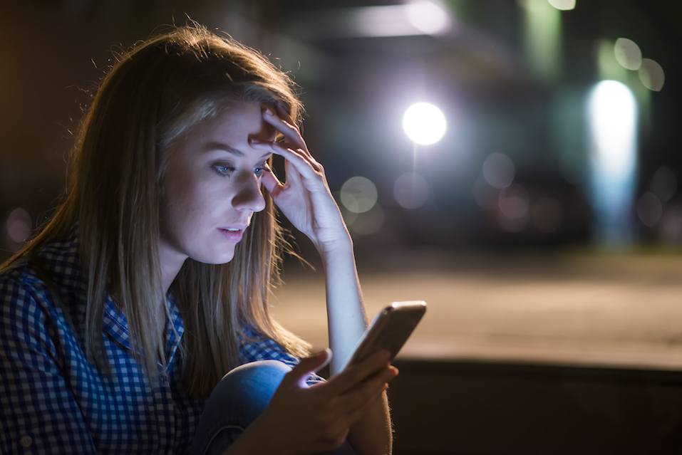 young woman got bad news with her smart phone