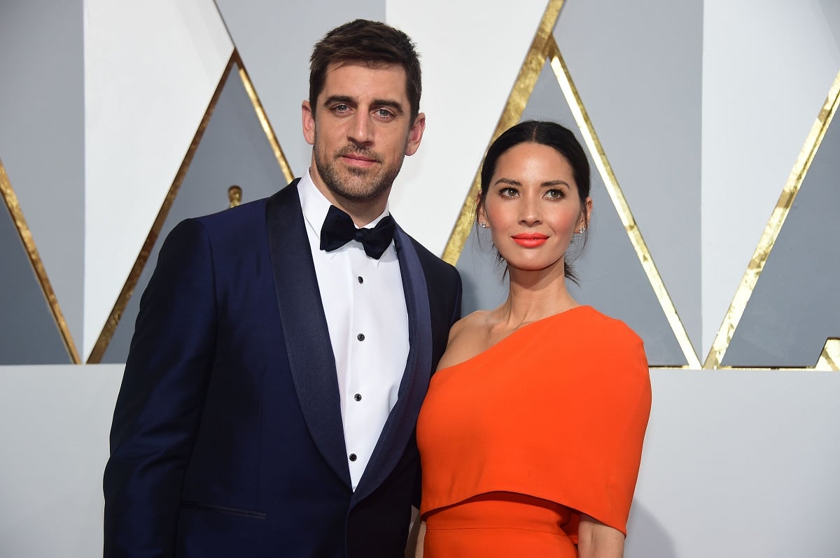 Aaron Rodgers (L) and actress Olivia Munn arrive on the red carpet for the 88th Oscars