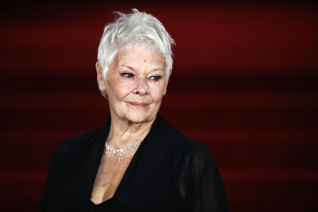 English actress Dame Judi Dench poses upon arrival to attend the world premiere of the film 'Murder