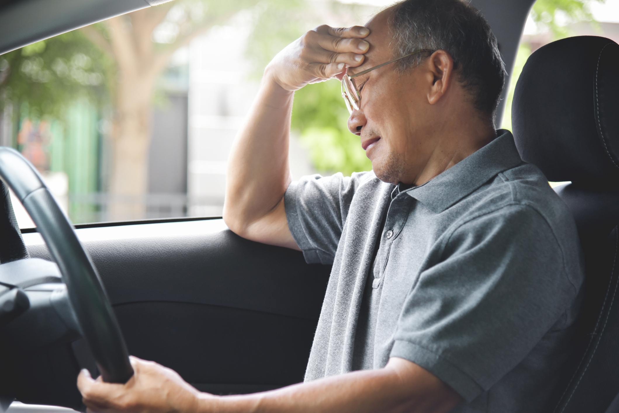 Senior man having difficulties driving