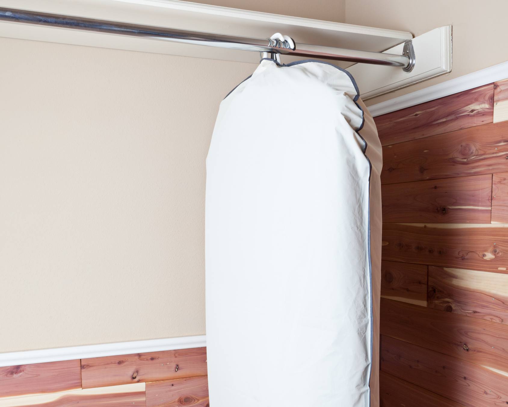 garment bag hanging in cedar closet