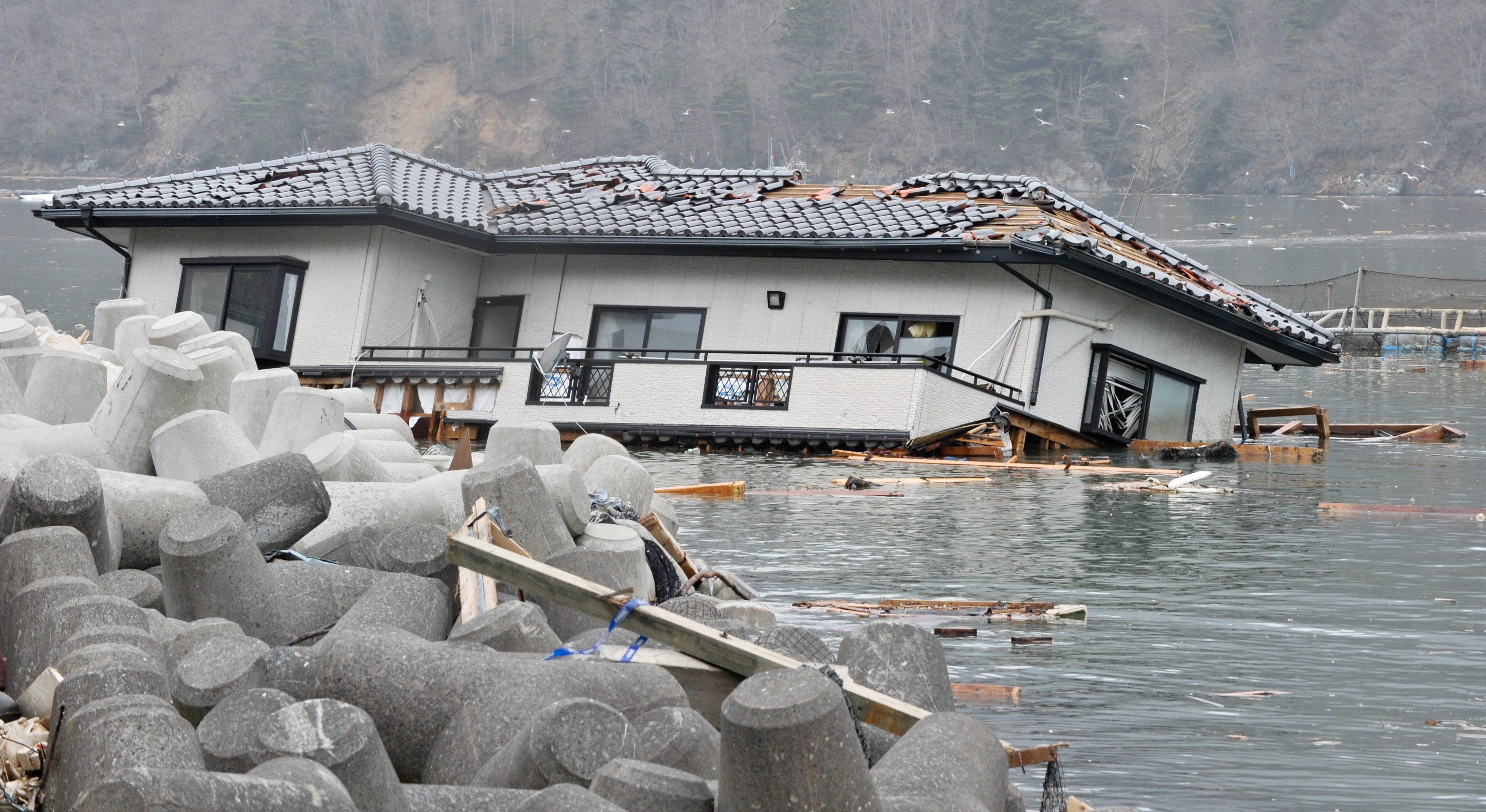 House in the sea after the tsunami in Japan
