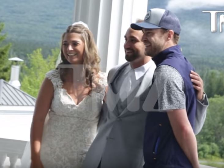Justin TImberlake poses with the newlyweds.
