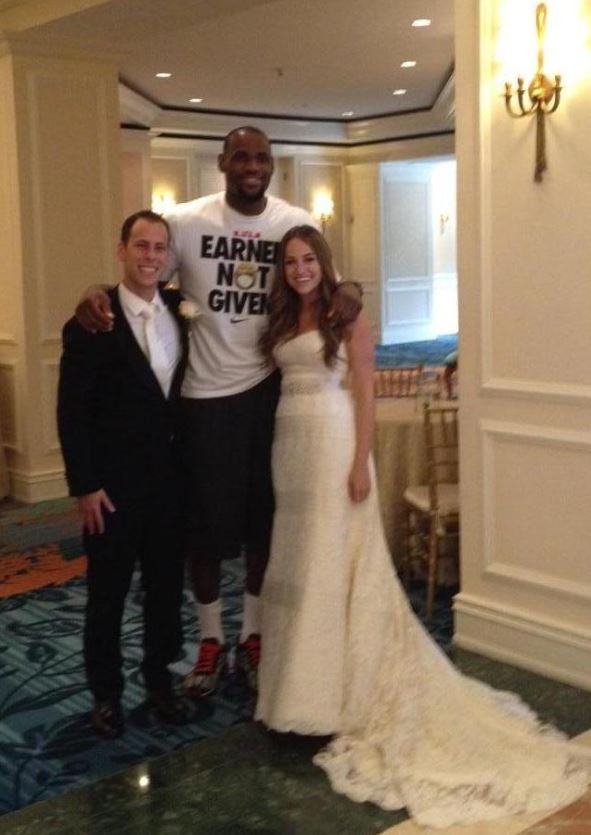 NBA star LeBron James poses with the happy newlyweds.