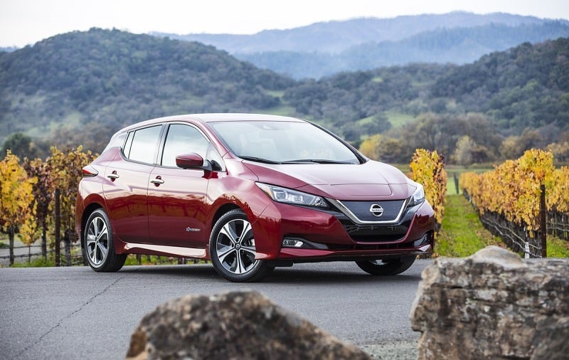 A red 2018 Nissan Leaf from driver's side