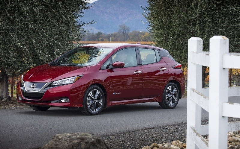 A red 2018 Nissan Leaf front three-quarter view