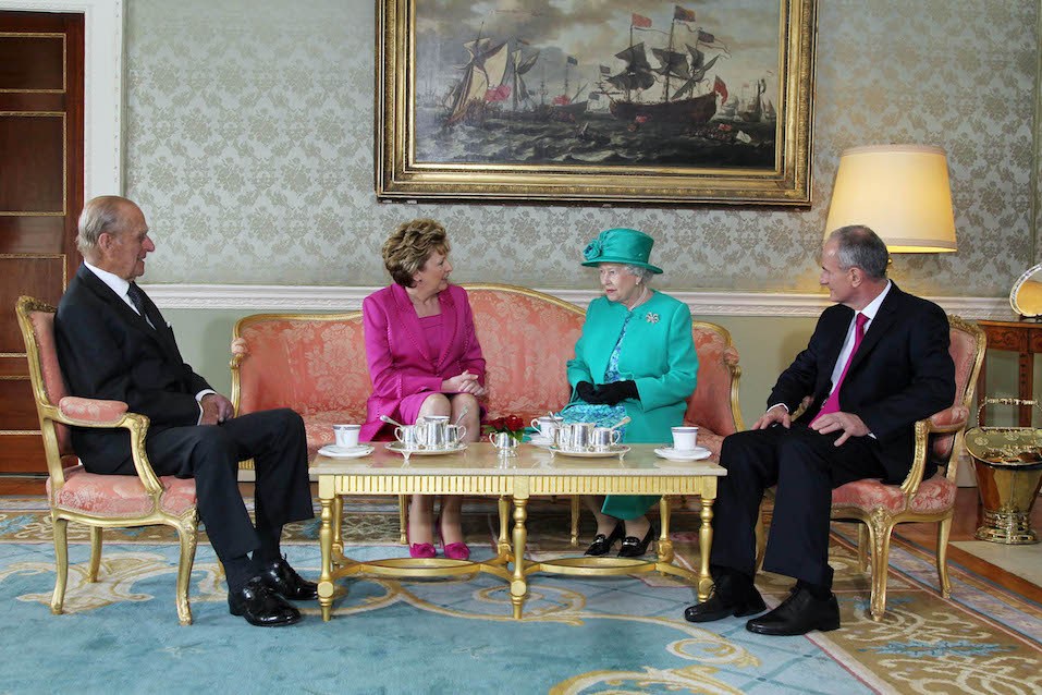 Prince Philip The Duke of Edinburgh, President Mary McAleese, Queen Elizabeth II, and Dr. Martin McAleese talk over a cup of tea