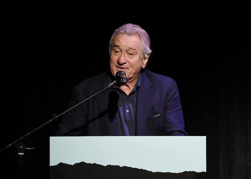 Robert De Niro making a speech on stage. Robert De Niro making a speech on stage.
