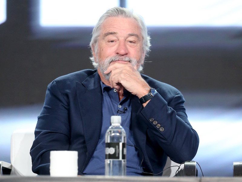 De Niro on stage during a panel. De Niro on stage during a panel.