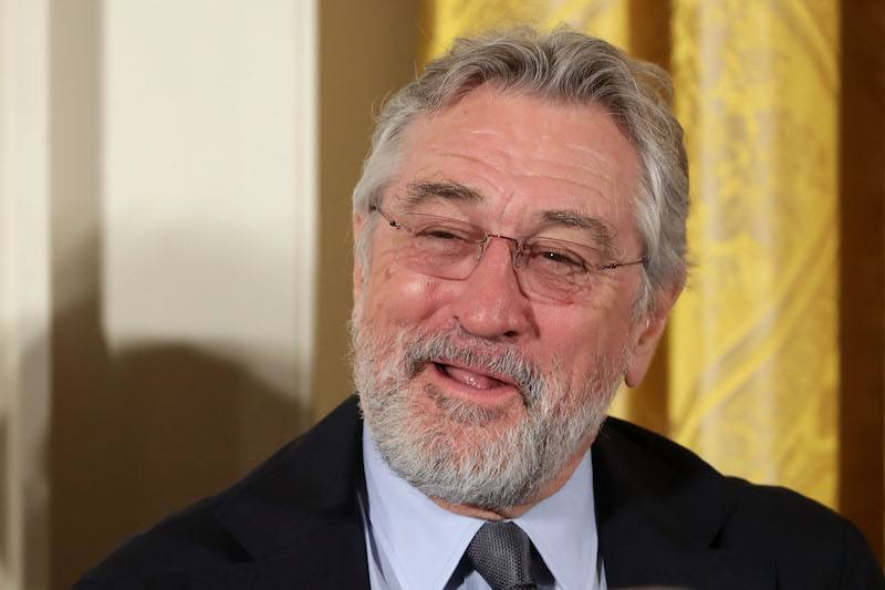 Robert De Niro smiling on a red carpet. Robert De Niro smiling on a red carpet.